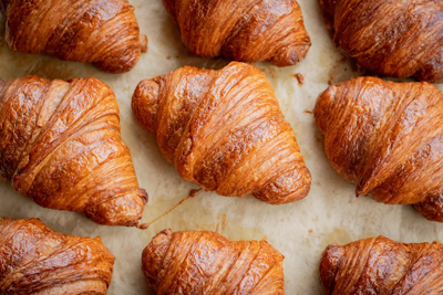 Butterbrew Croissants. Flakey golden pastry, filled with real butter or rich almond magic.
